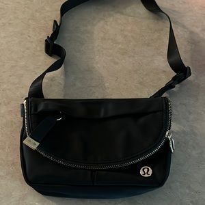 Black cross body LuLu Lemon bag.